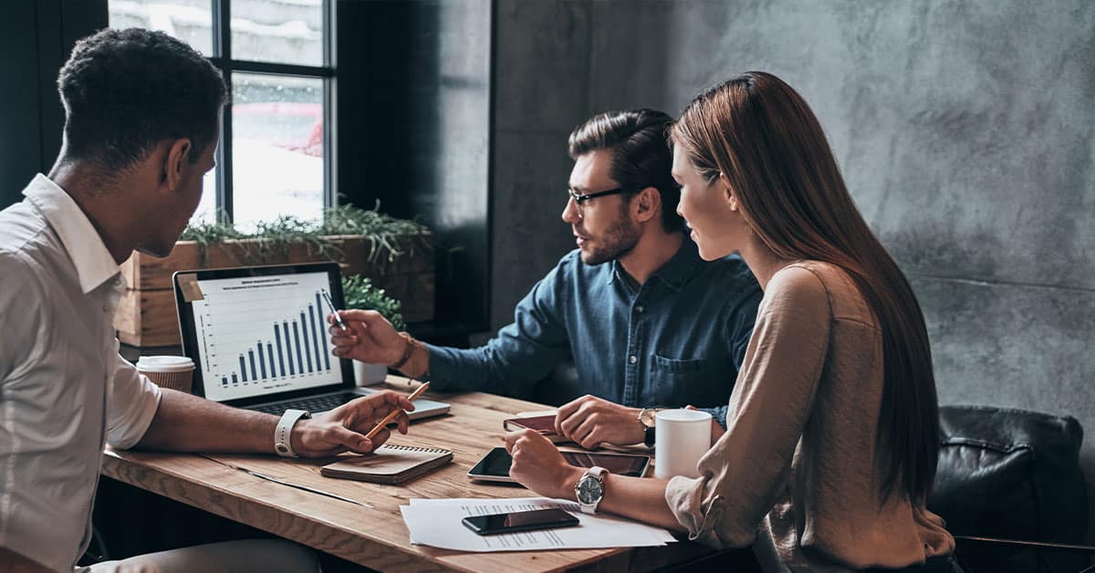 a group of people sitting at a table