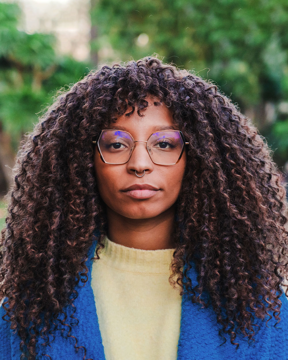 a close up of a woman wearing glasses